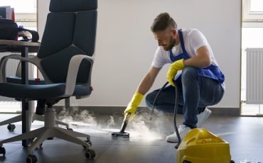 professional-cleaning-service-person-using-steam-cleaner-office