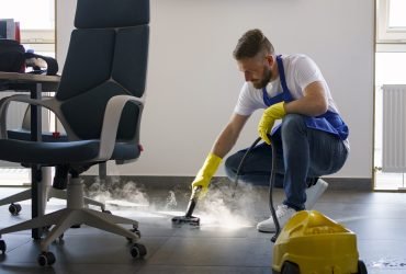 professional-cleaning-service-person-using-steam-cleaner-office
